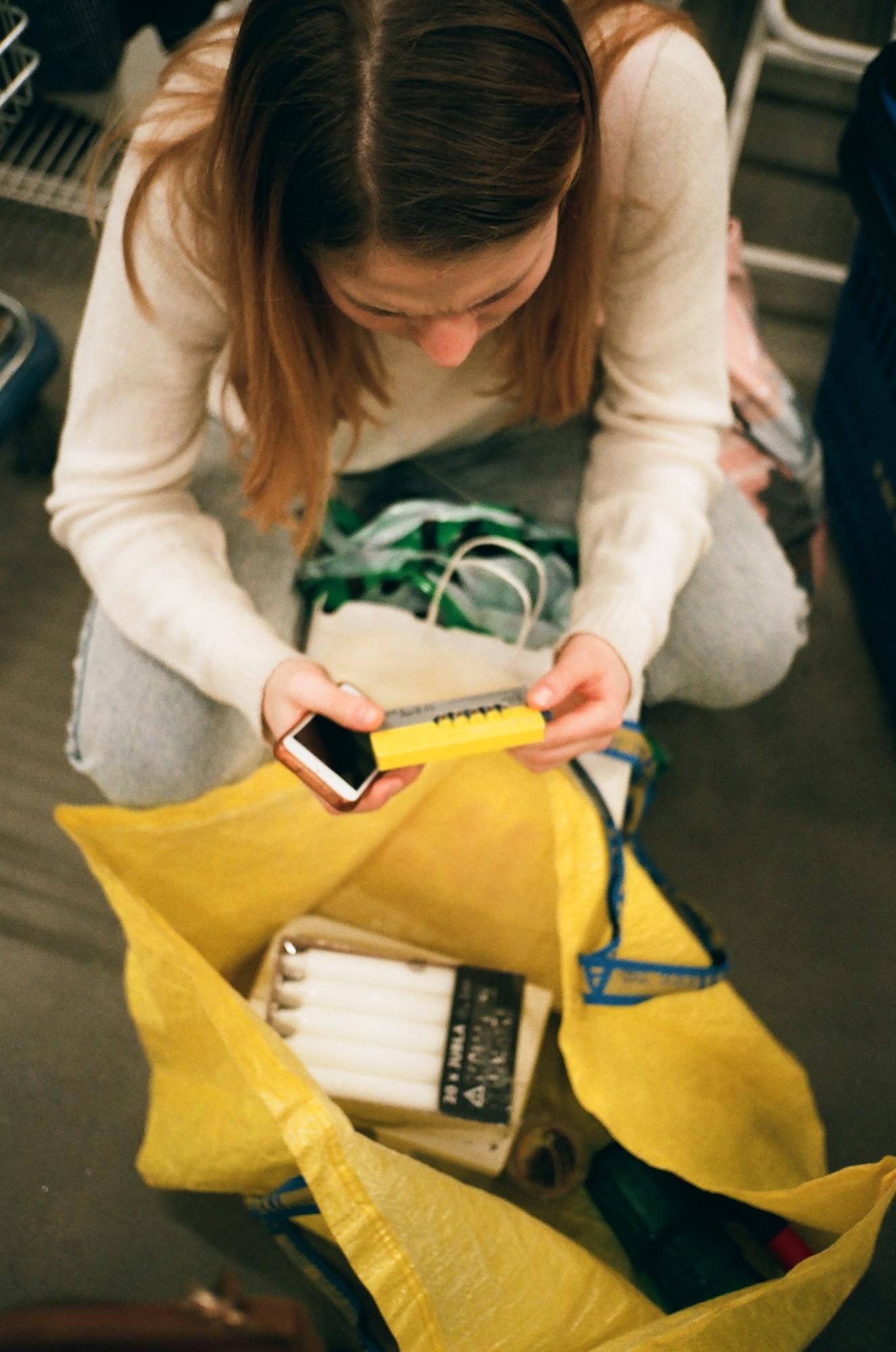 A woman going through her shopping bag 
