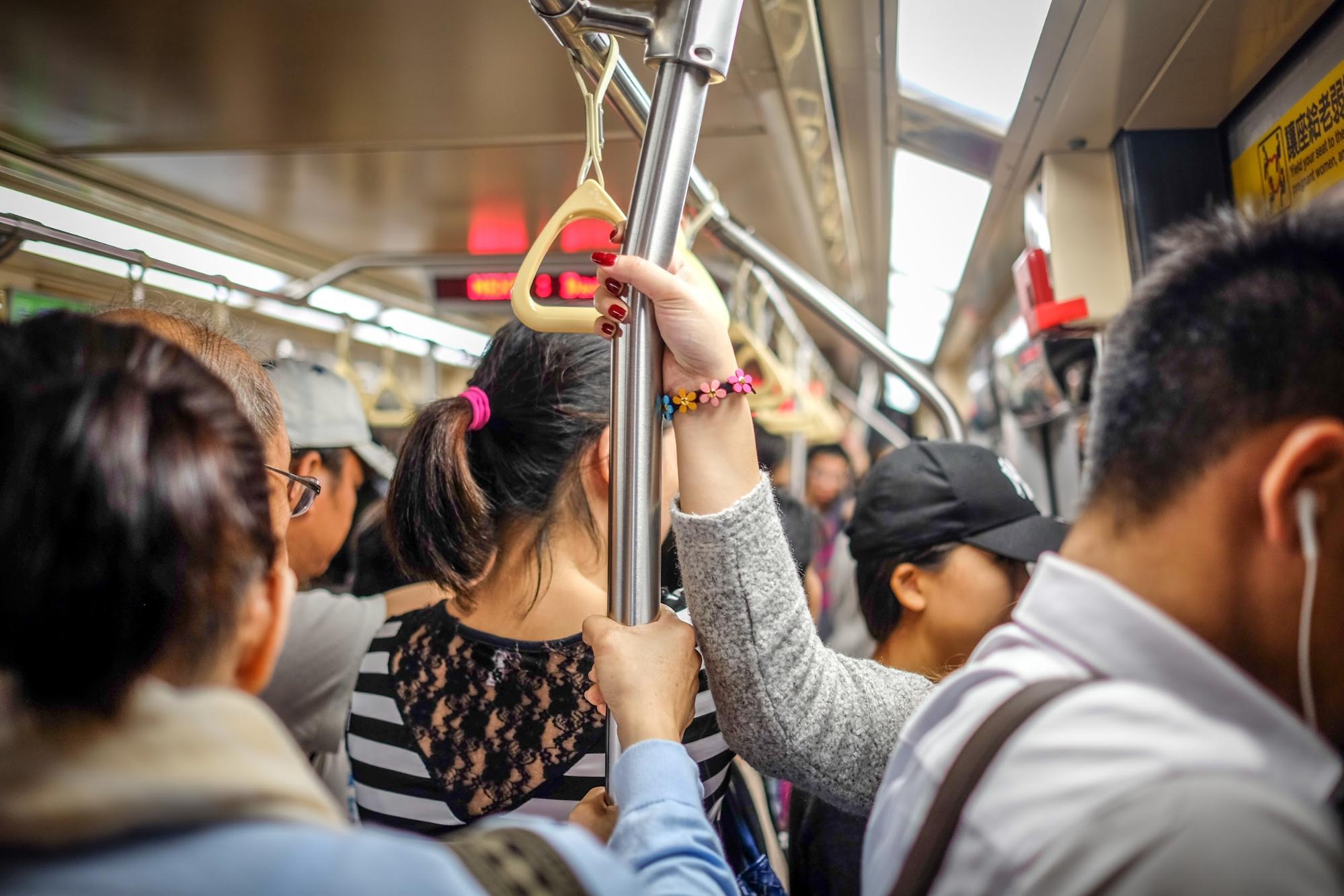 Holding a hand pole on a train in Japan