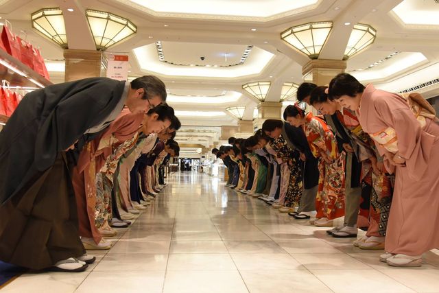 Japanese hospitality - staff at department store bowing