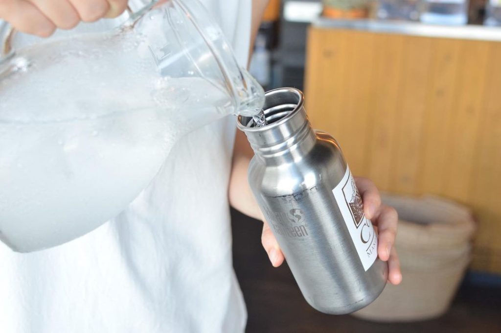 Japan travel tips - pouring water into a tumbler