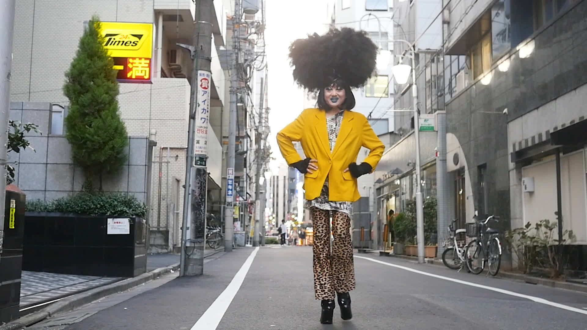 A person in yellow blazer on the streets