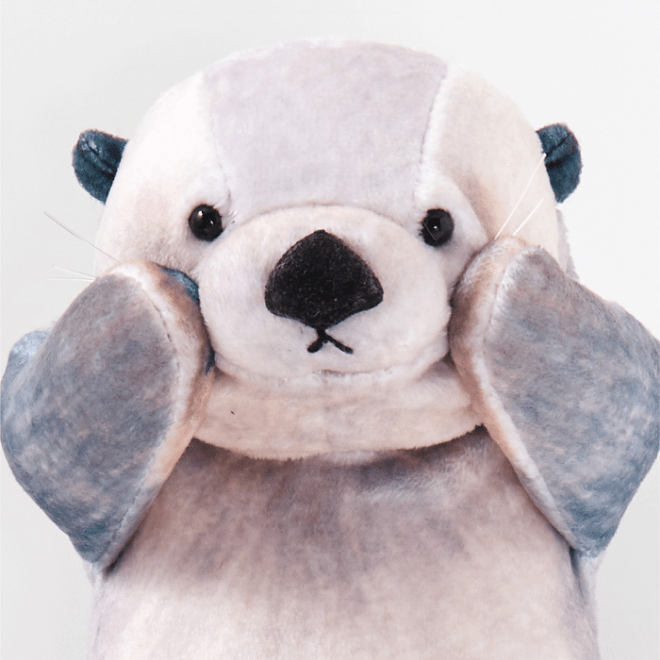 sea otter pouch - paw on cheek
