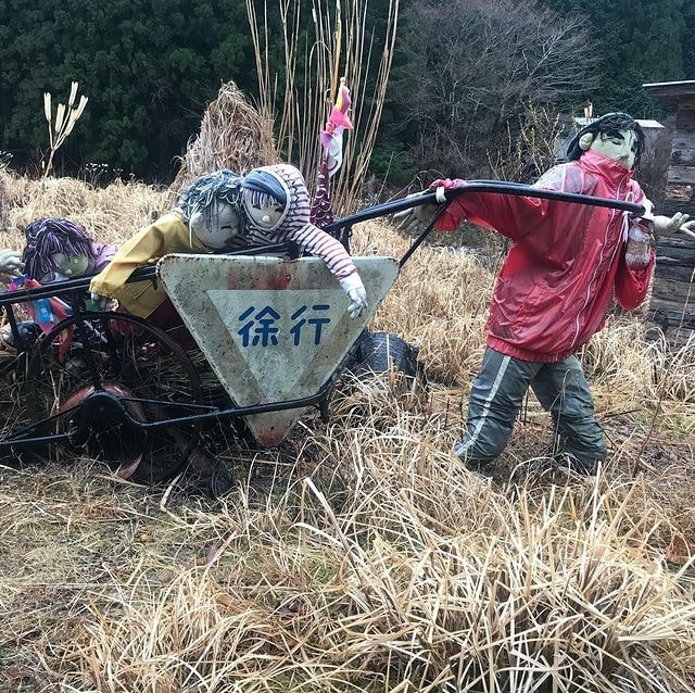 Japanese Scarecrow Village - working in a field