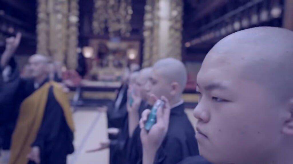 Japanese Monks Dance To EDM - monks eating ramune