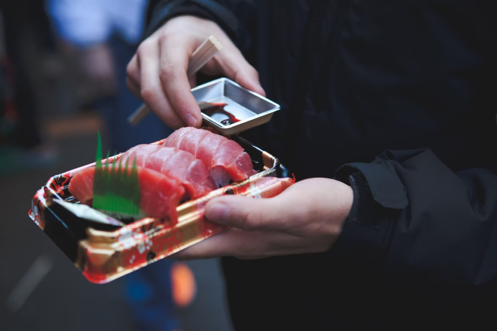 new years tuna - tuna sashimi with hand