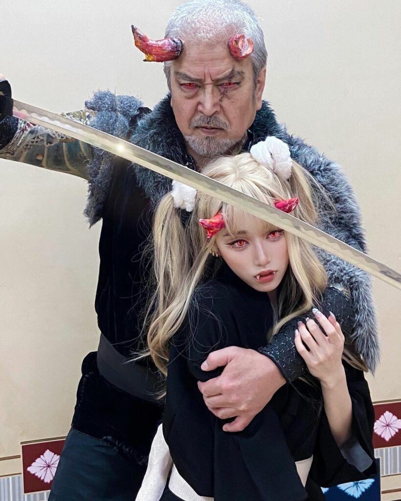 Japanese girl cosplays with father - father and daughter wearing horns