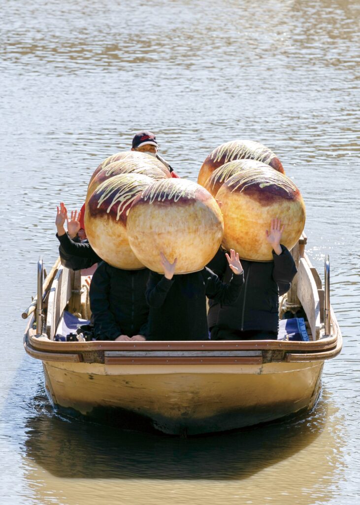 Takoyaki Boat - boat sailing down ono river with takoyaki 