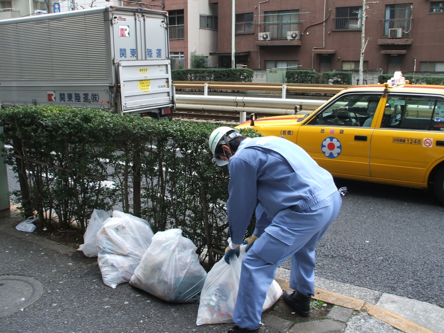 Garbage disposal in Japan - waste collector collecting trash