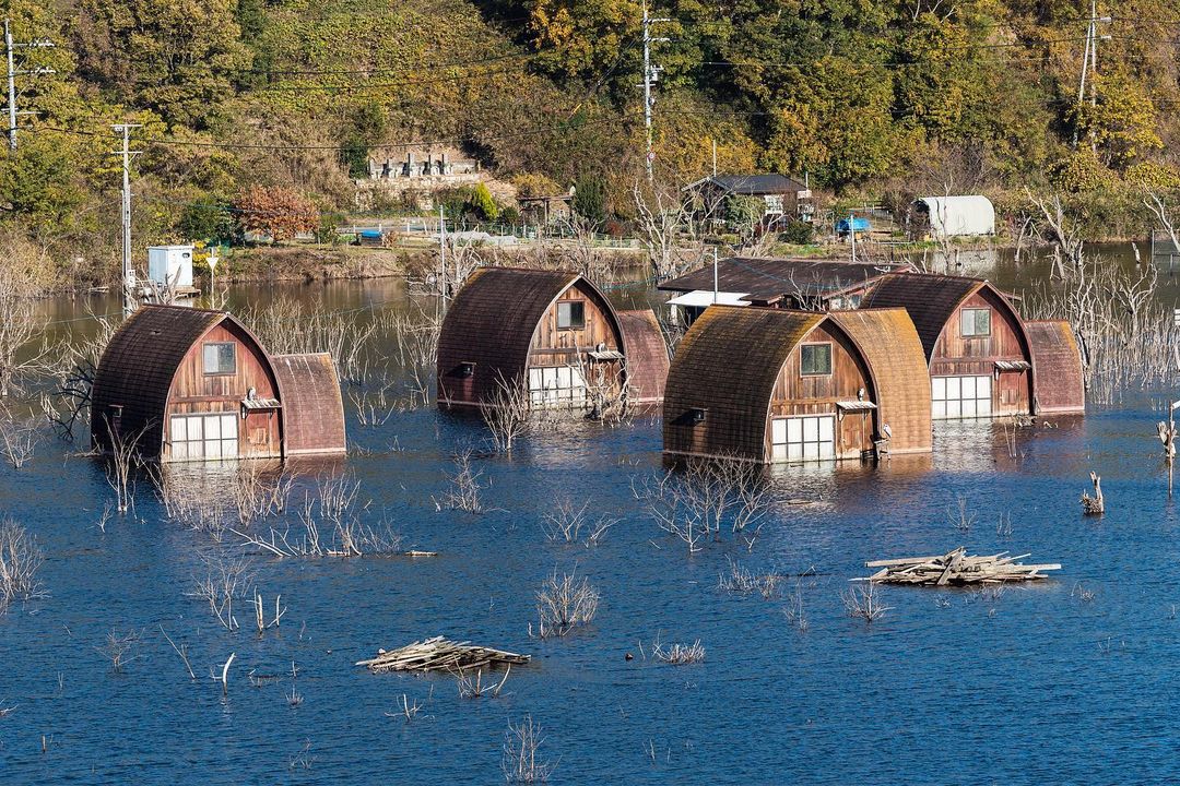 Ushimado Green Farm Ruins - rusty houses in a pool of water