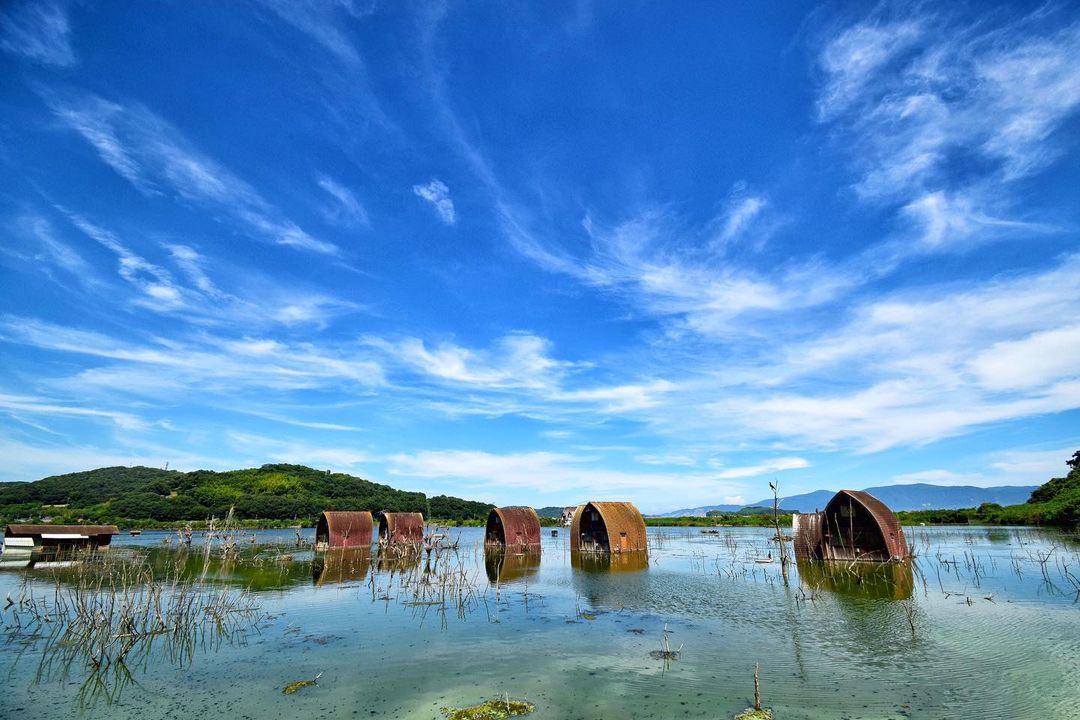 Ushimado Green Farm Ruins - rusty houses in a pool of water