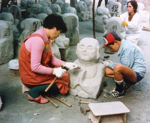 Otagi Nenbutsu-ji - people learning the art of stone sculpture