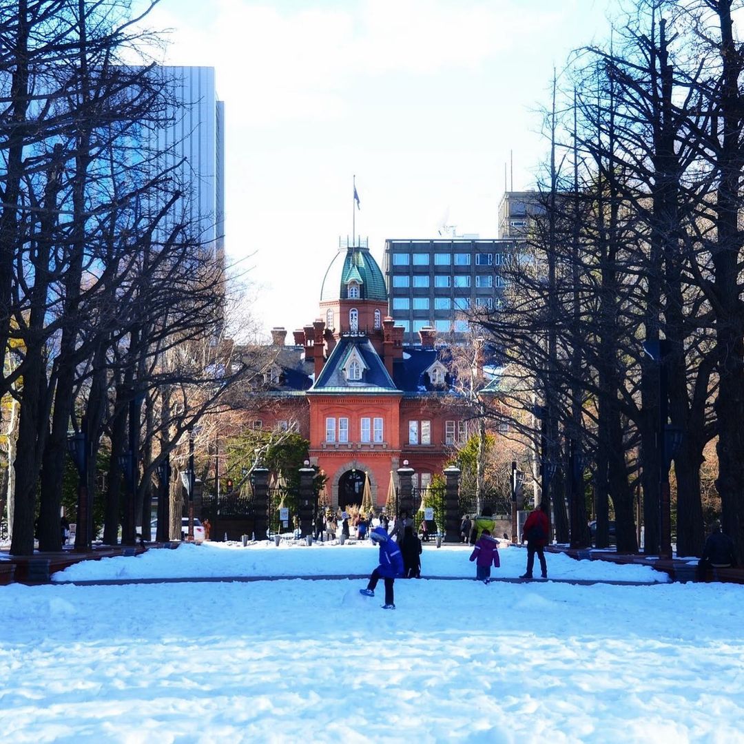 Cities in Japan to see snow - red building in Odori Park