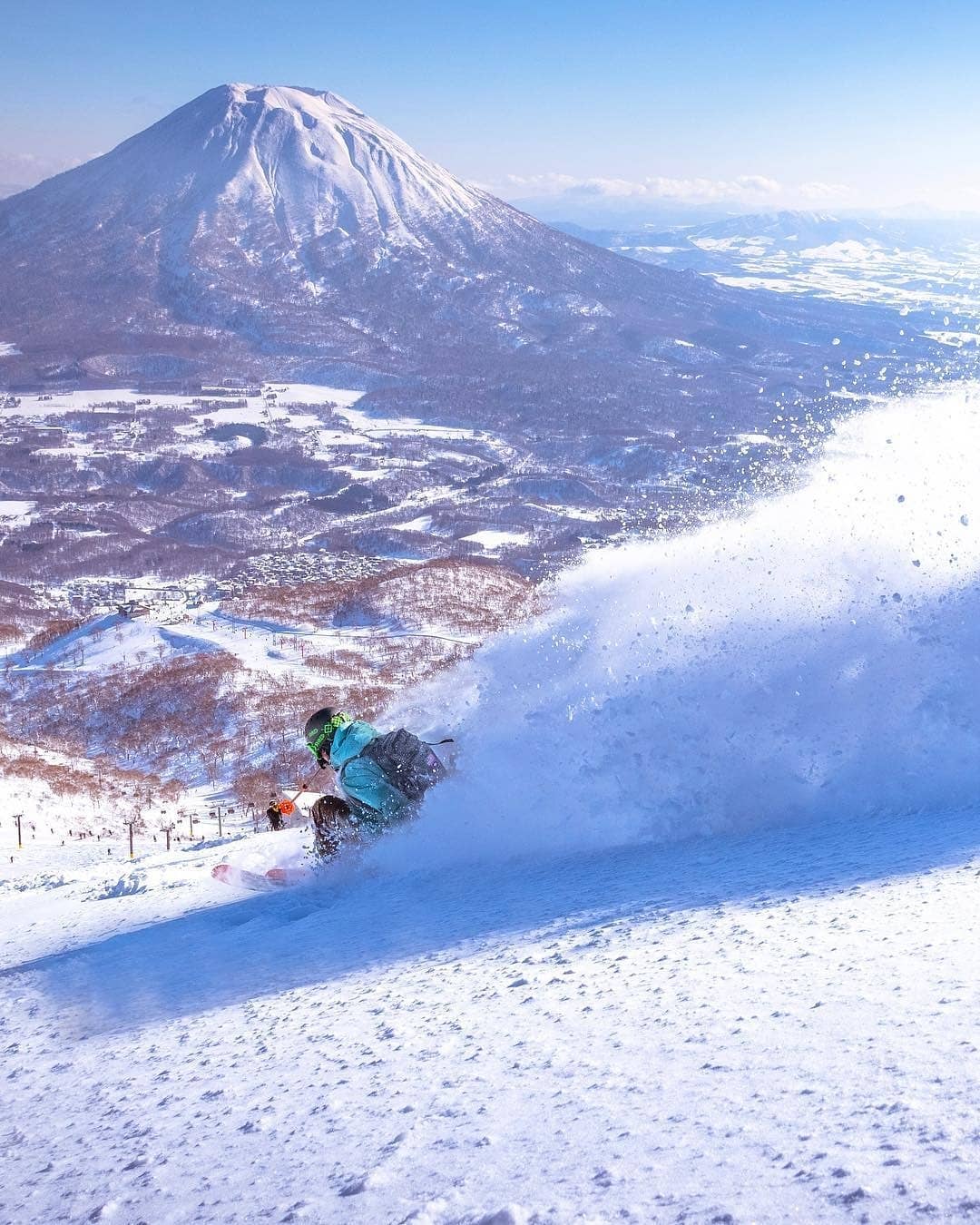 Cities in Japan to see snow - person skiing at Niseko