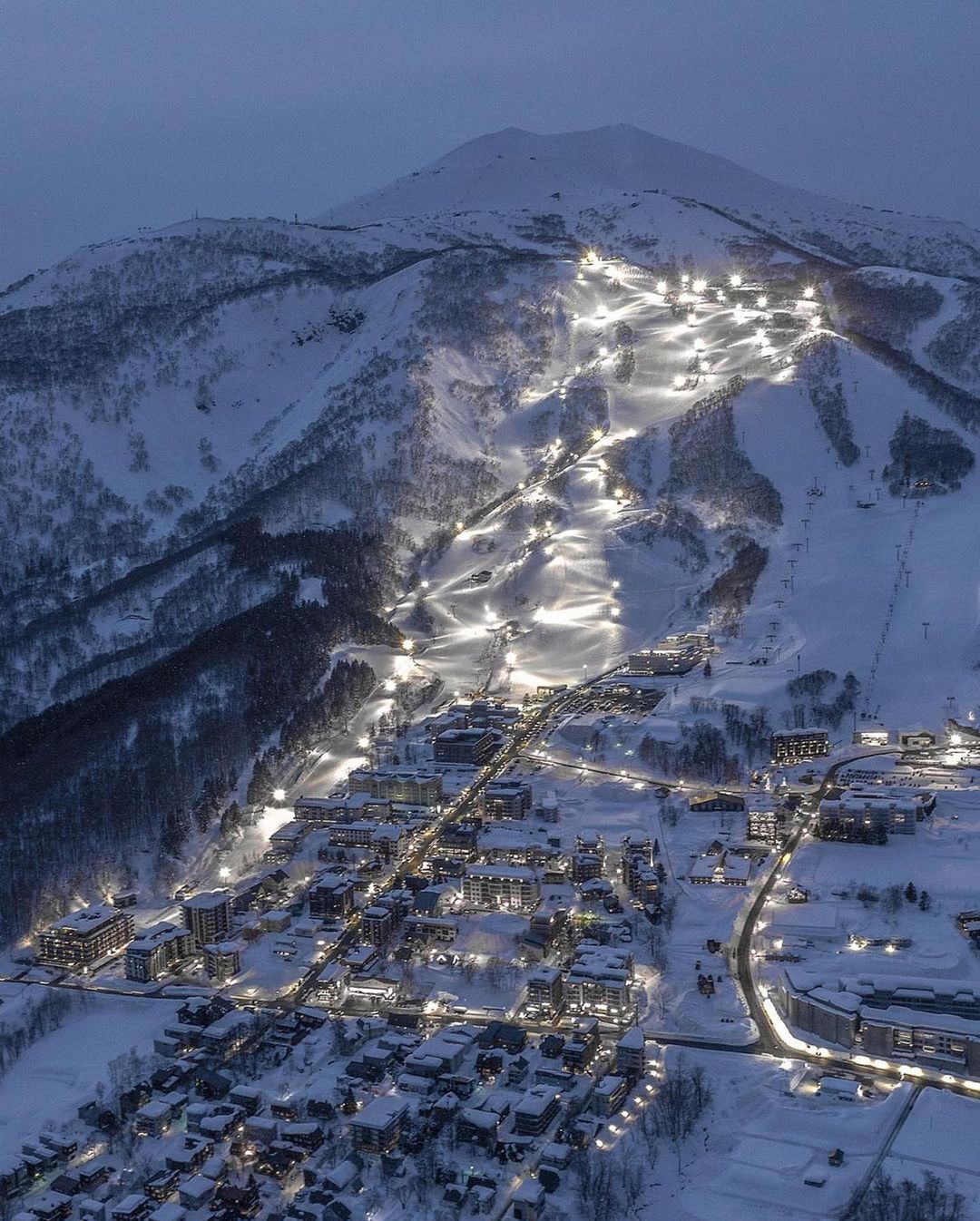 Cities in Japan to see snow - Bird's-eye view of skii resorts in Niseko at night