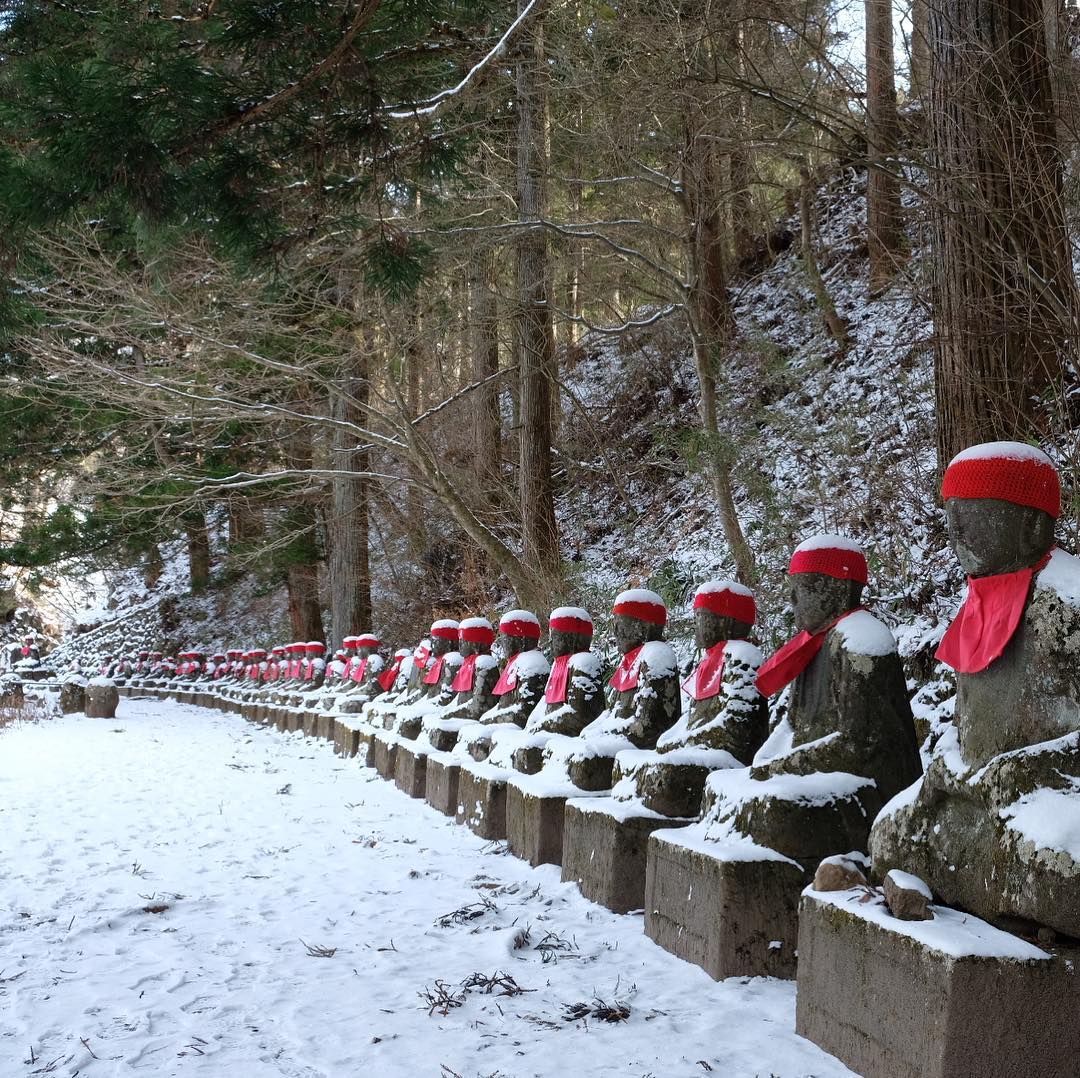 Cities in Japan to see snow - stone Jizo statues at Kanmangafuchi Abyss