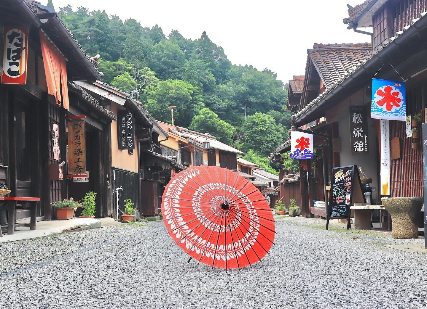 Fukiya Furusato Village - red umbrella in the middle of Fukiya Furusato Village's streets
