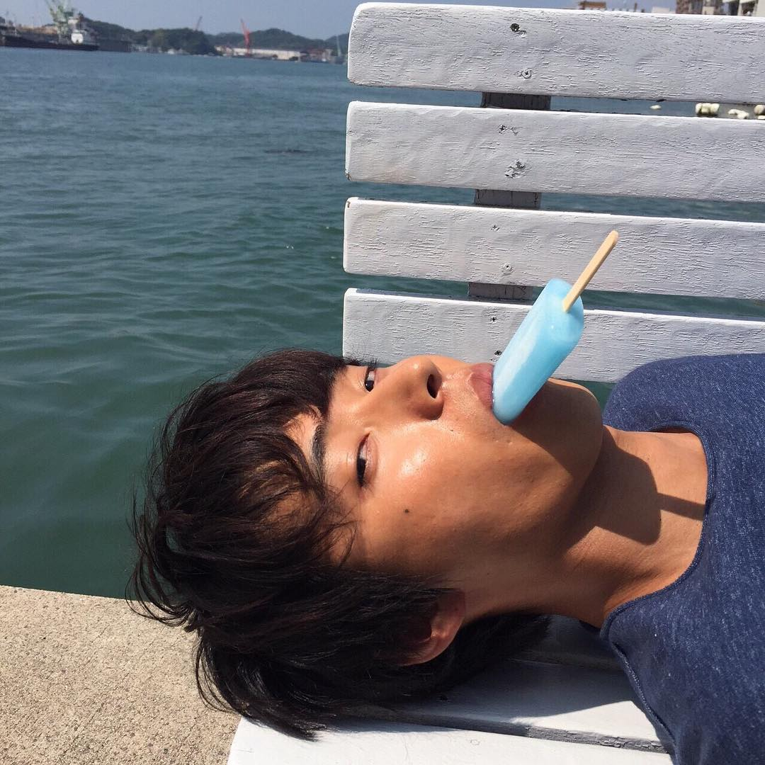Kento Yamazaki facts - Kento Yamazaki lying down with a popsicle in his mouth